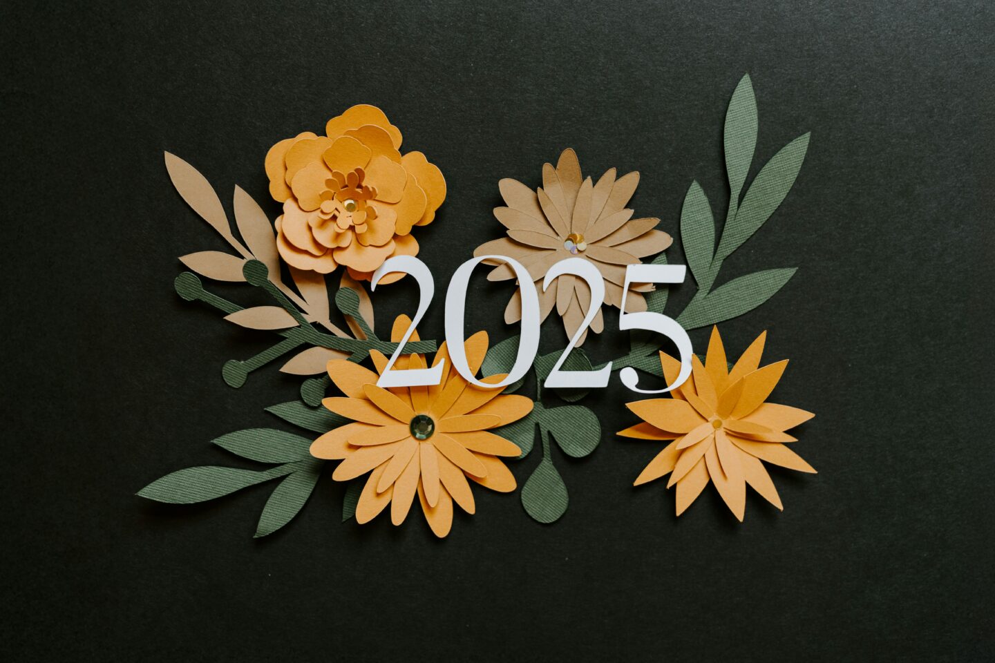 a black background with a floral arrangement with the number 2025 on top